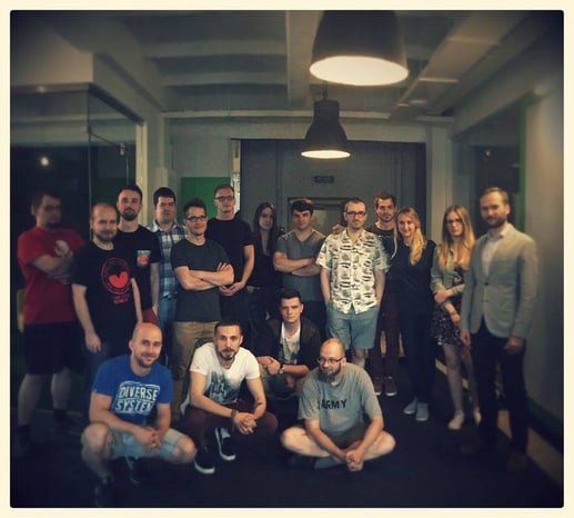 A group of people gathered for an office photo.