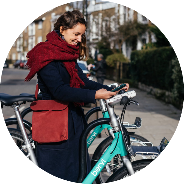 A woman using the app to rent a Beryl bicycle.