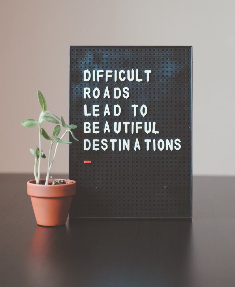 How I changed working hard to working smart - A sign that says: Difficult Roads Lead To Beautiful Desttinations.