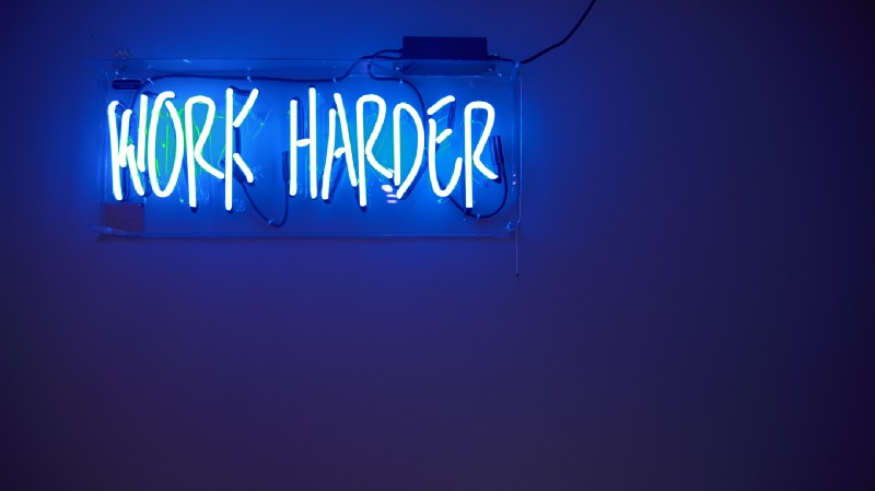 How I changed working hard to working smart - WORK HARDER sign